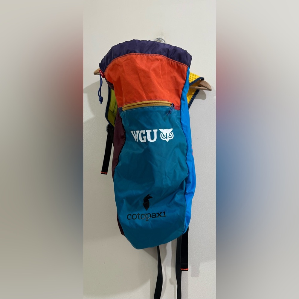 cotopaxi colorblock backpack — teal, orange, purple, yellow